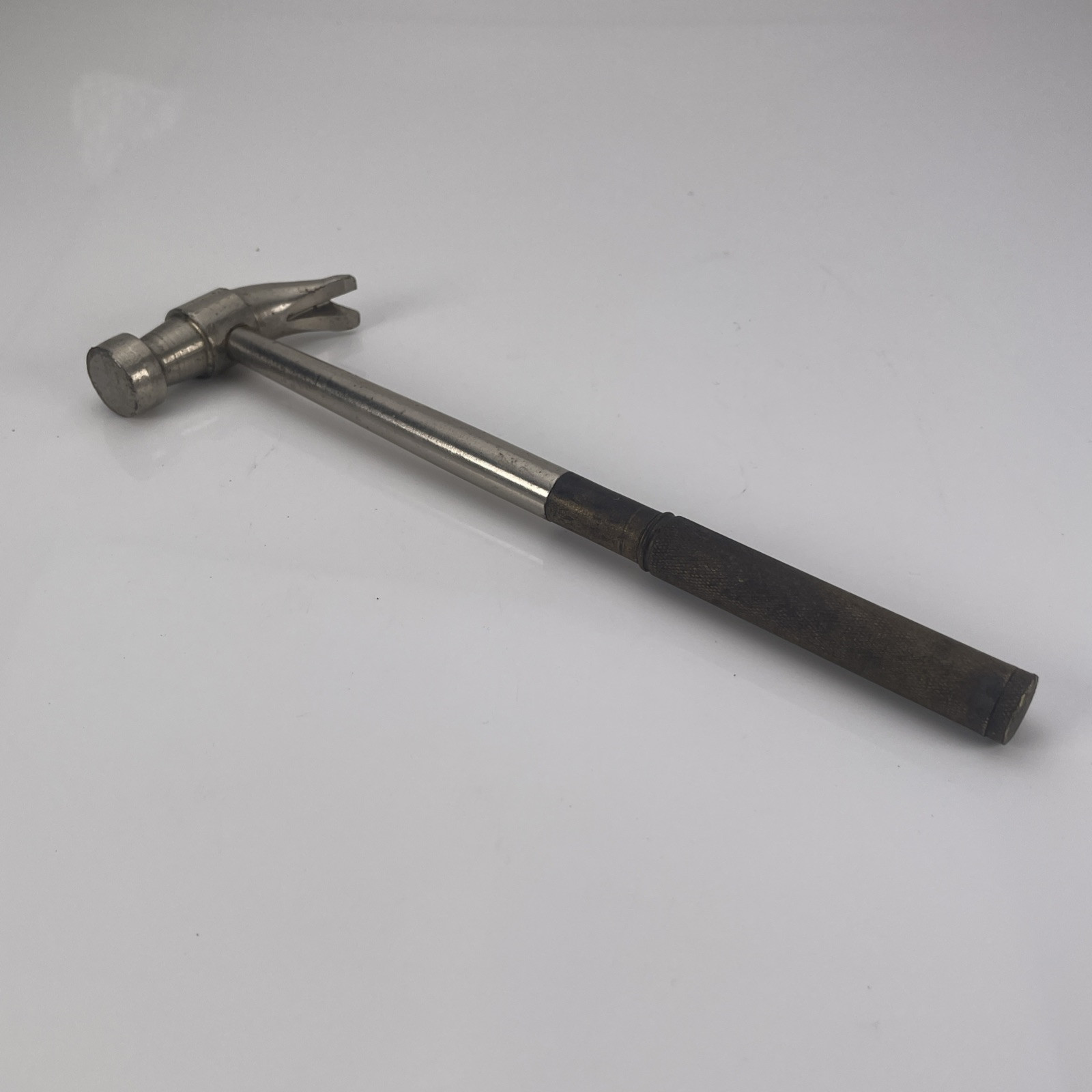 Small Claw Hammer With Brass Handle and Four Nested Flat Tip Screwdrivers