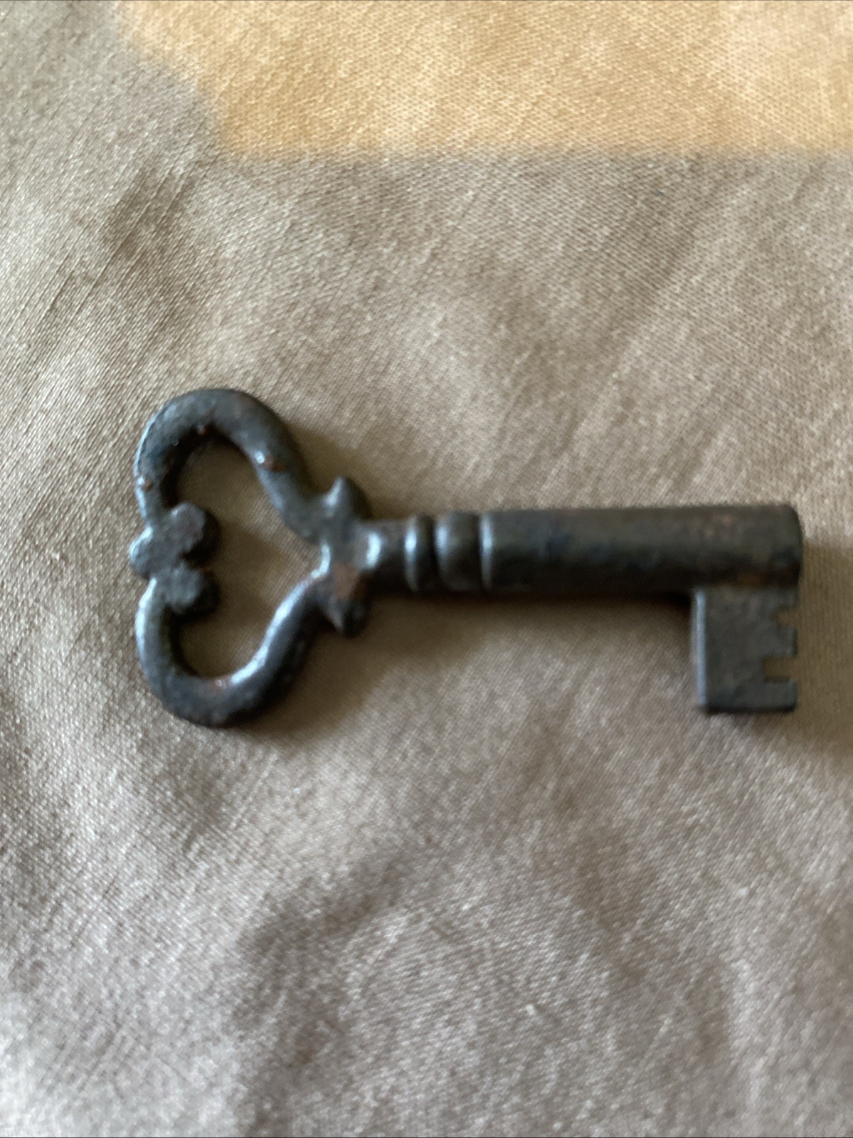 Vintage hollow steel key with heart shaped bow