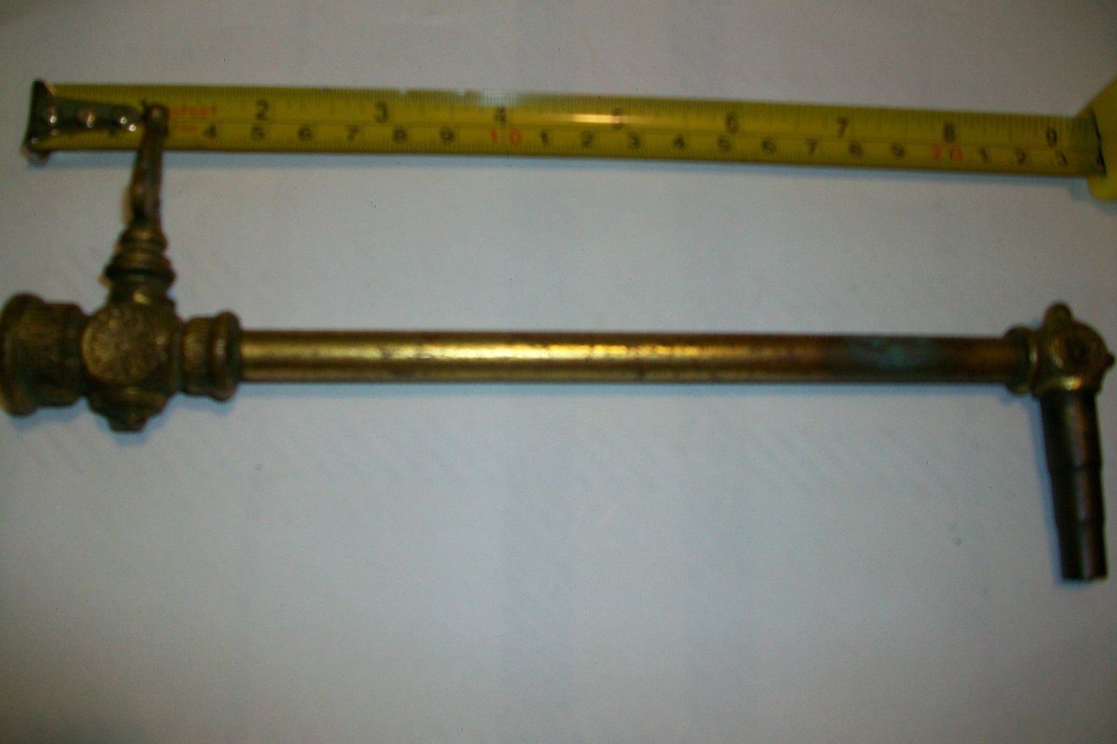 Antique vintage brass ornate gas shut off line valve.