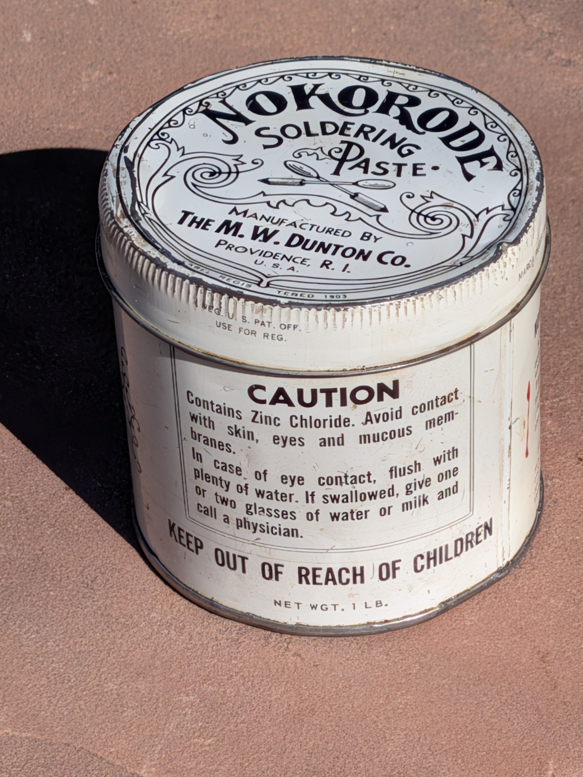 Nokorode Soldering Paste Tin 3” wide x 3 1/2″” tall 1926 Patent $8.50