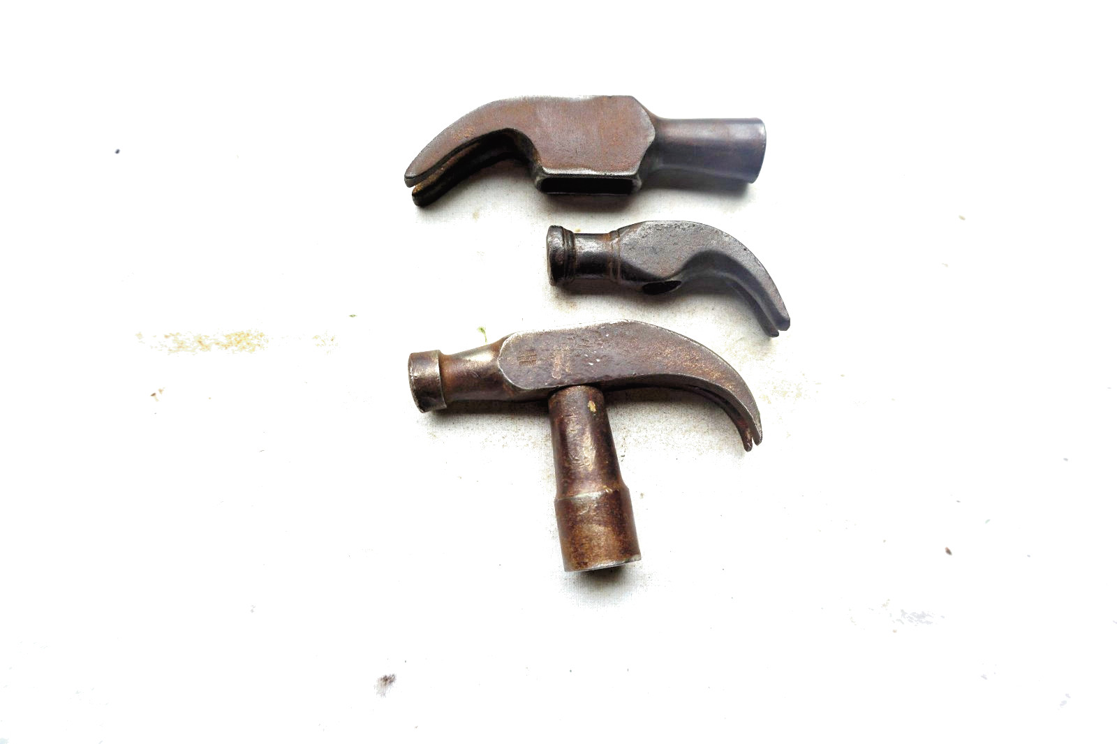 LOT OF 3 SMALL CLAW HAMMER HEADS – WEIGHT 2 OZ., 3 OZ., and 4 OZ.