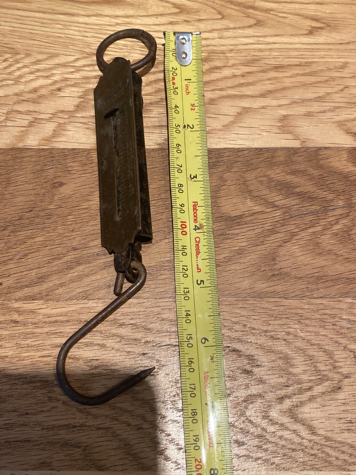 Vintage brass-fronted pocket spring balance. Weighs up to 25lbs using a hook.