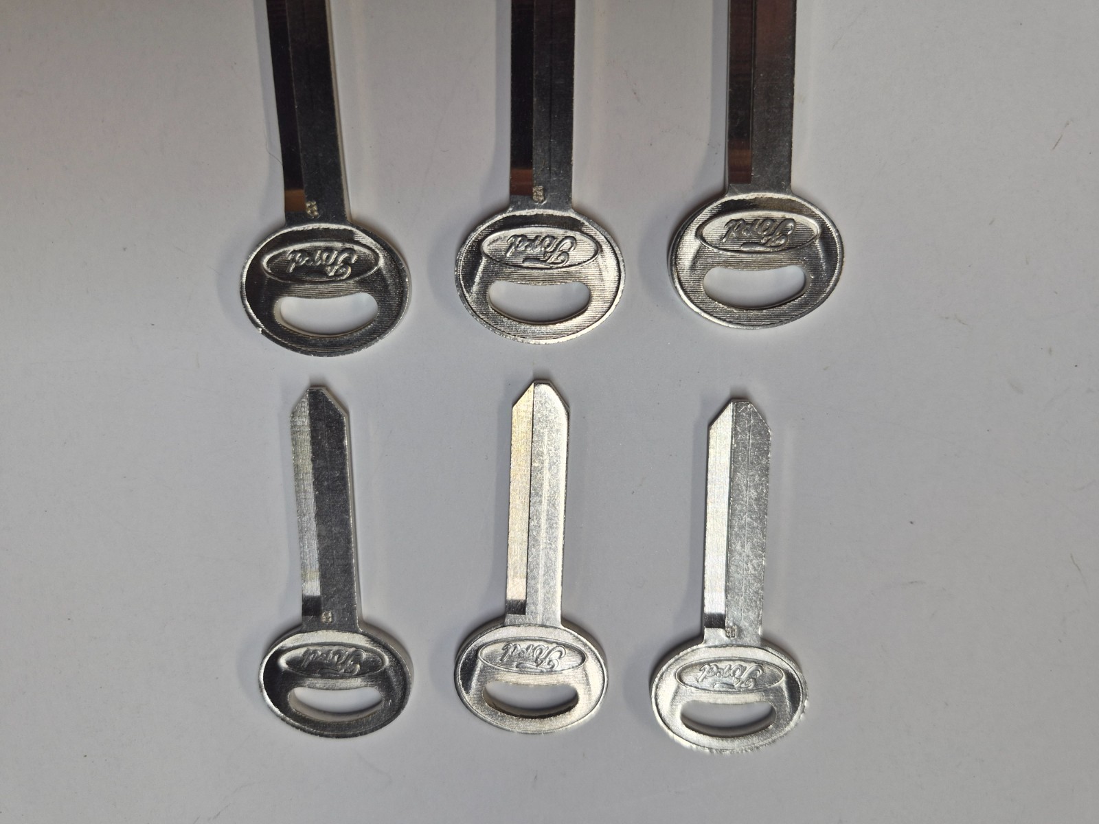 LOT 6 VINTAGE FORD FAMILY OF FINE CARS KEYS BLANKS OVAL LOGO 1960’s – 90’s MINT