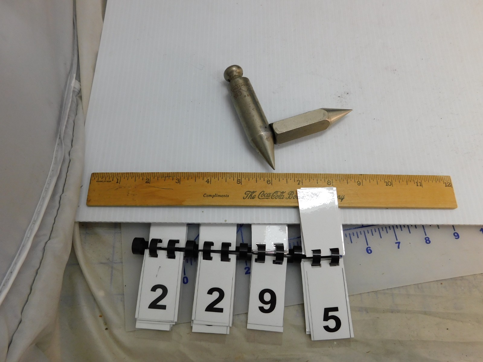 2 plumb Bobs , Miller Falls #3, 8 oz. 4″, plus an unmarked one