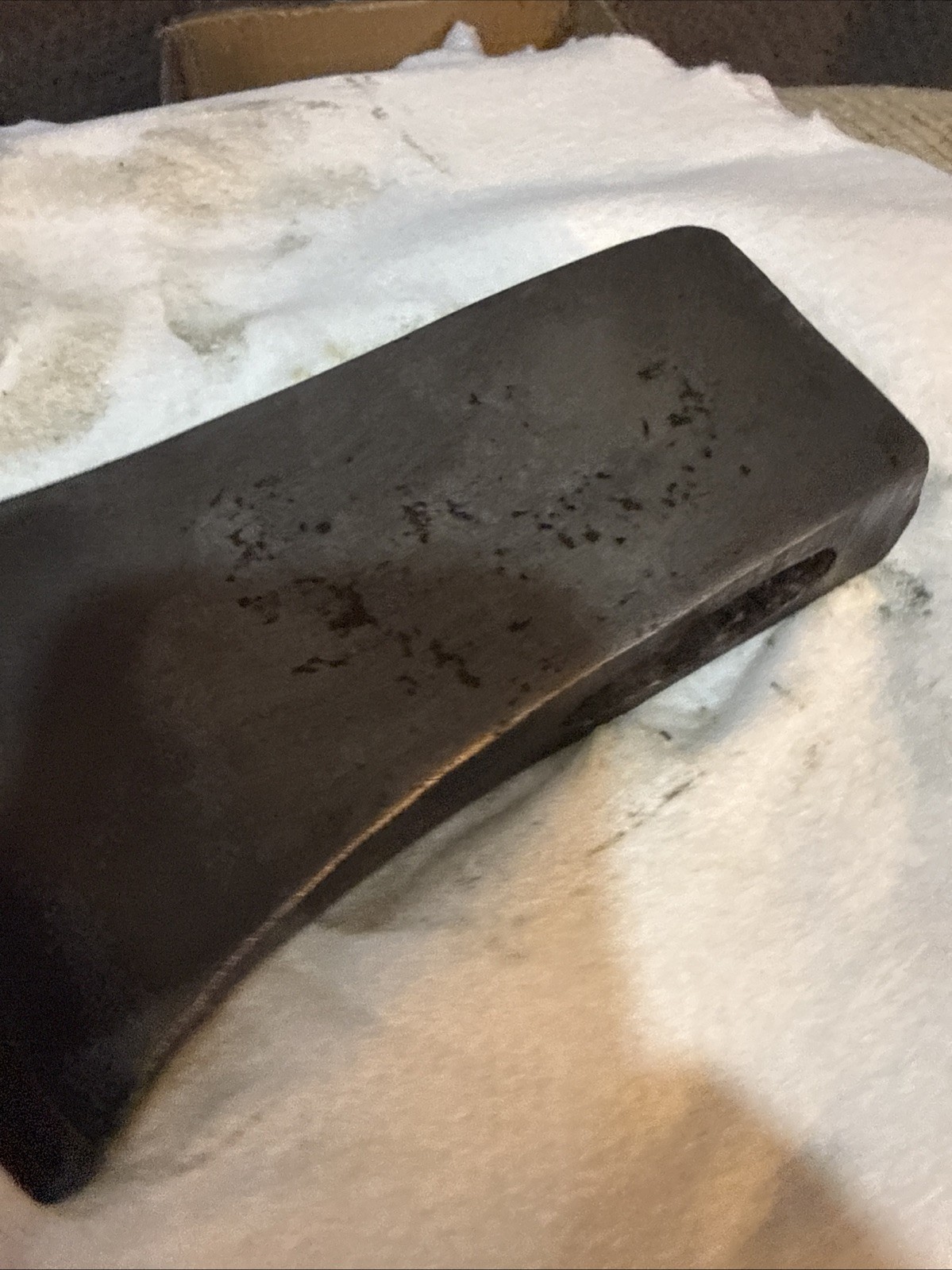 This vintage single-bit axe head By Mann Edge Tool Co.