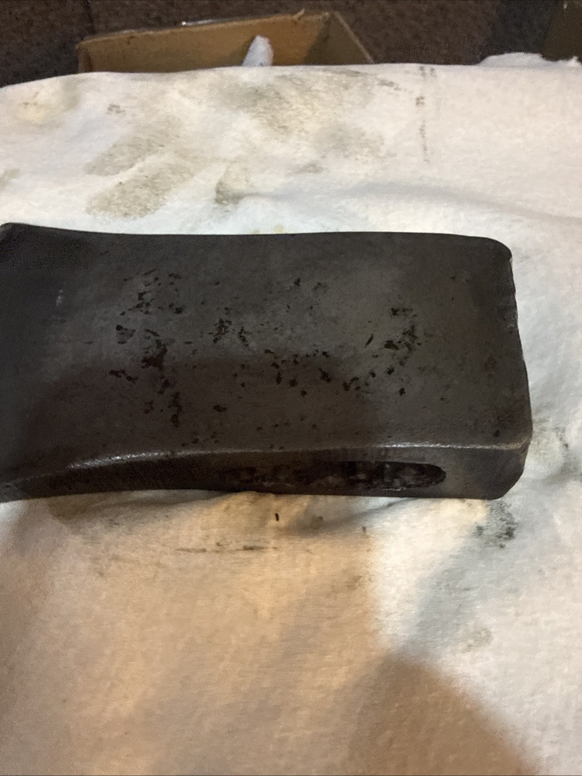 This vintage single-bit axe head By Mann Edge Tool Co.