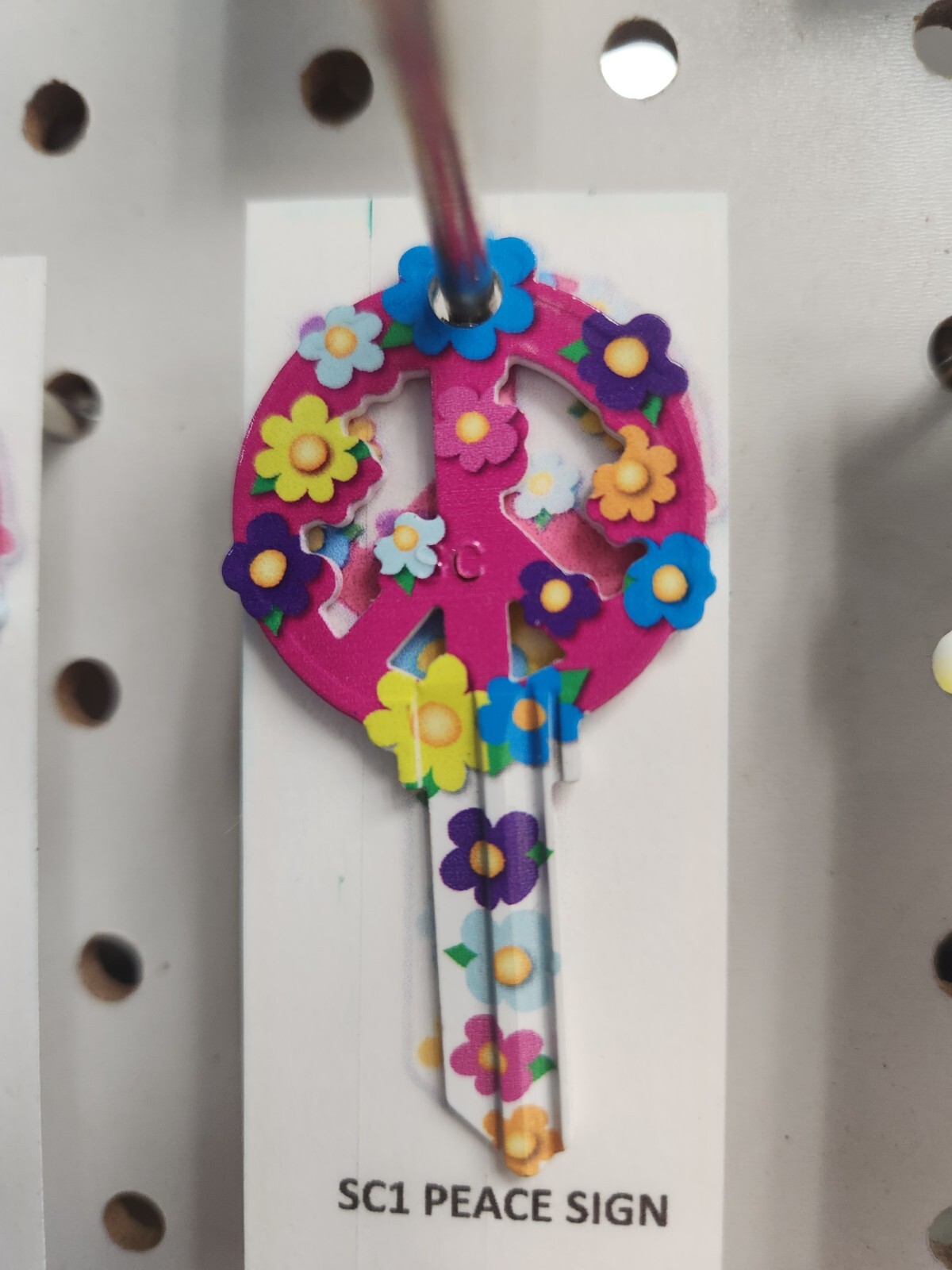 PEACE SIGN WITH FLOWERS SHAPED SCHLAGE SC1 KEYBLANK – READ DETAILS BELOW