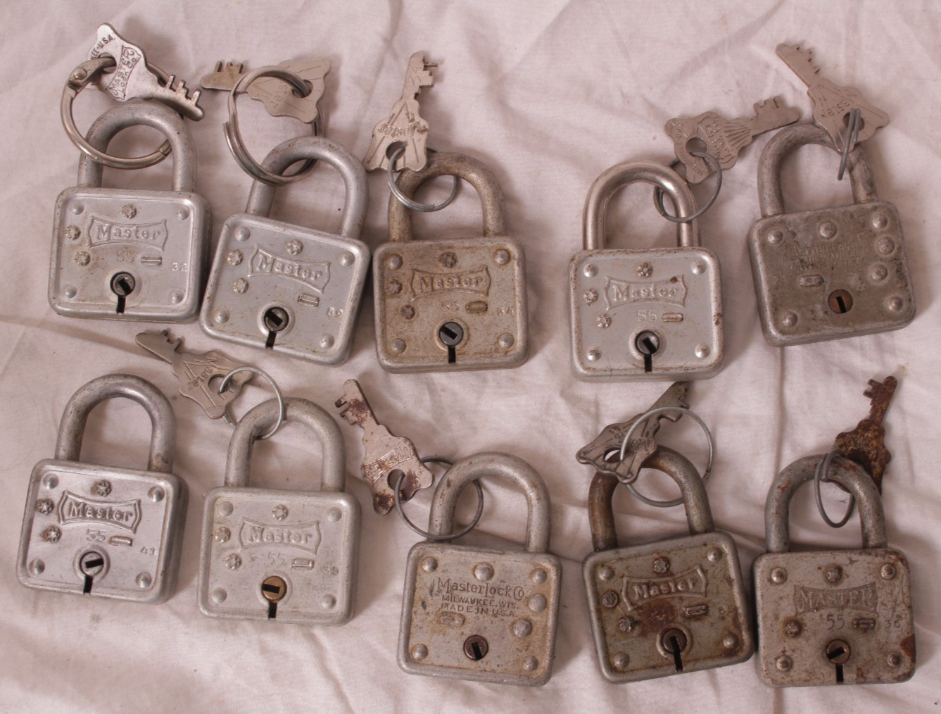 set of 10 Antique Master Lock Padlocks No. 55 with 9 Original Keys – some rust