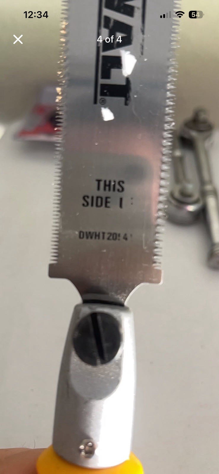 Handy DEWALT jab saw has a yellow and black handle. Saw has a silver blade.