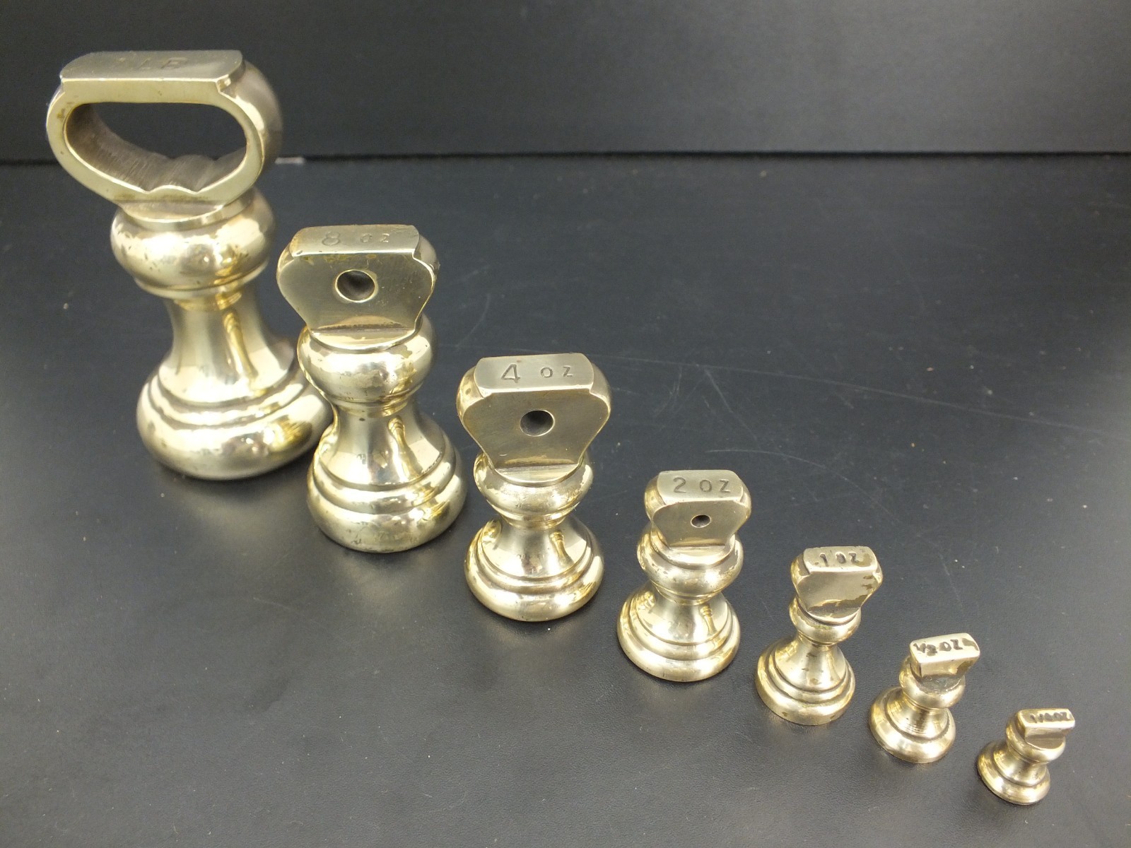SET OF 7 VINTAGE BRASS BELL WEIGHTS 1LB – 1/4 OZ KITCHEN SCALES