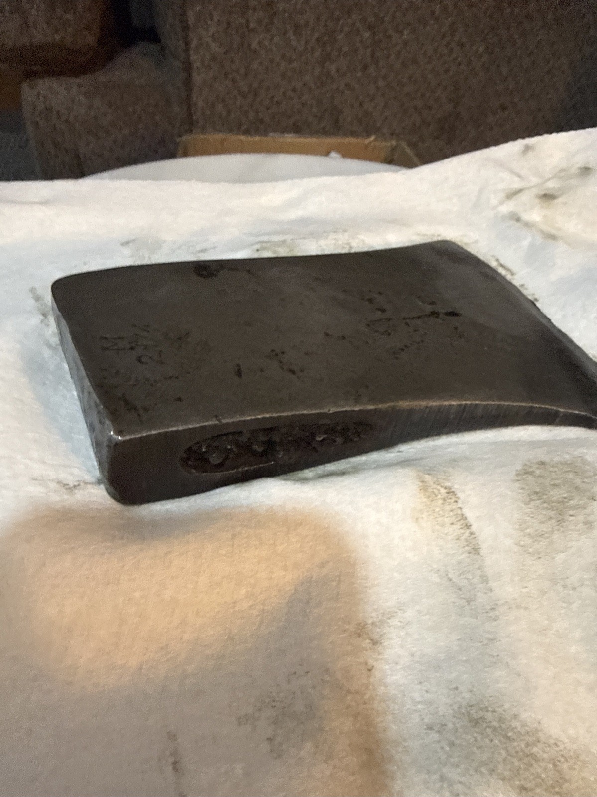 This vintage single-bit axe head By Mann Edge Tool Co.