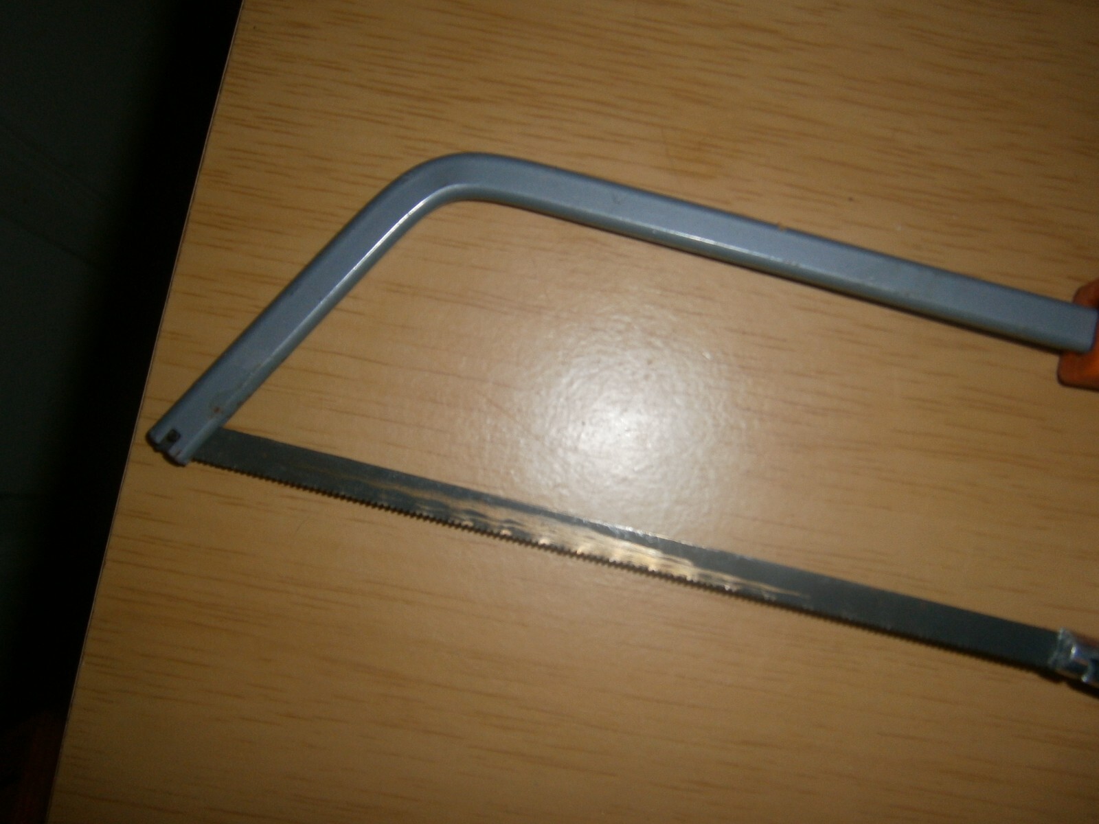 Vintage silver/black/orange tone small hacksaw. (E6d)