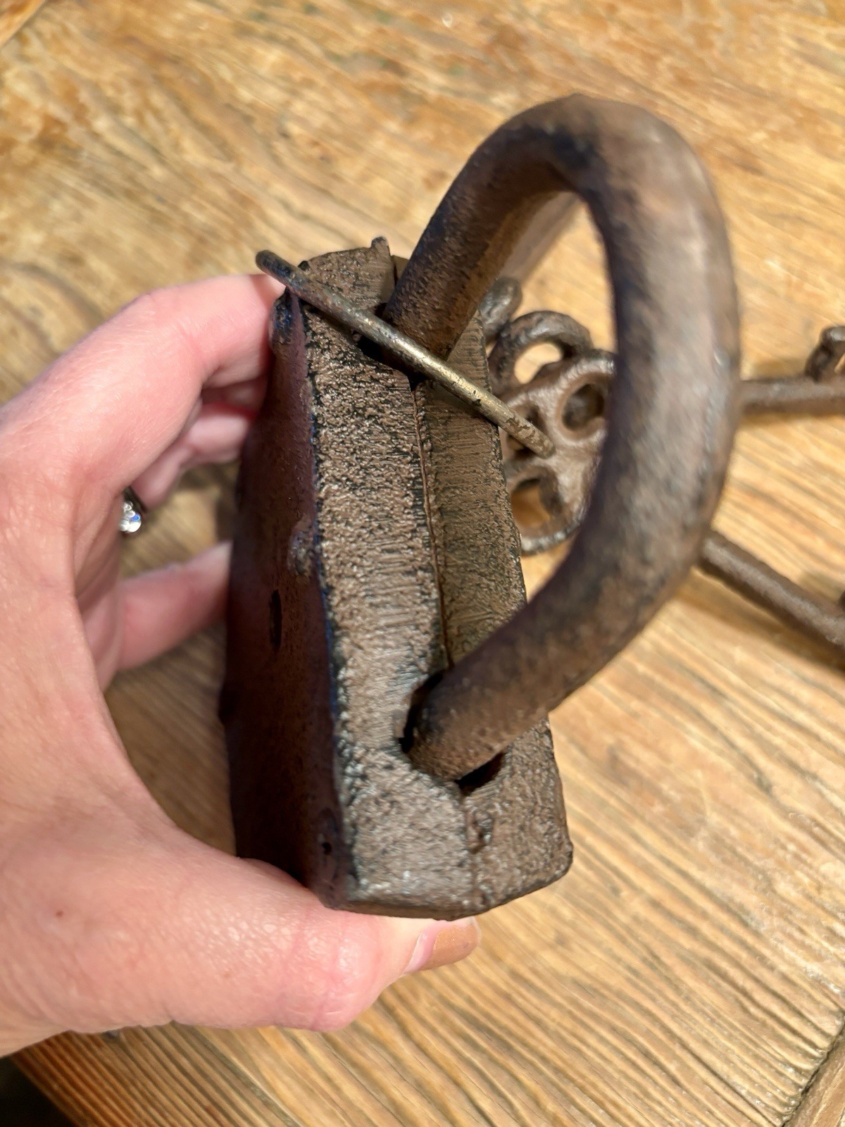 Vintage cast iron padlock with three skeleton keys on a ring.