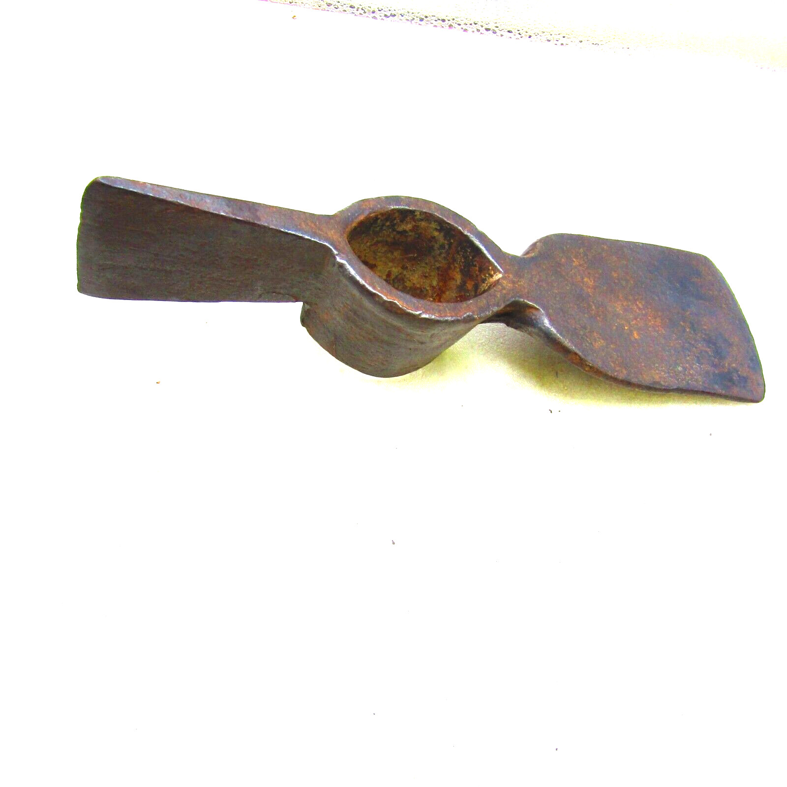 Antique mattock head