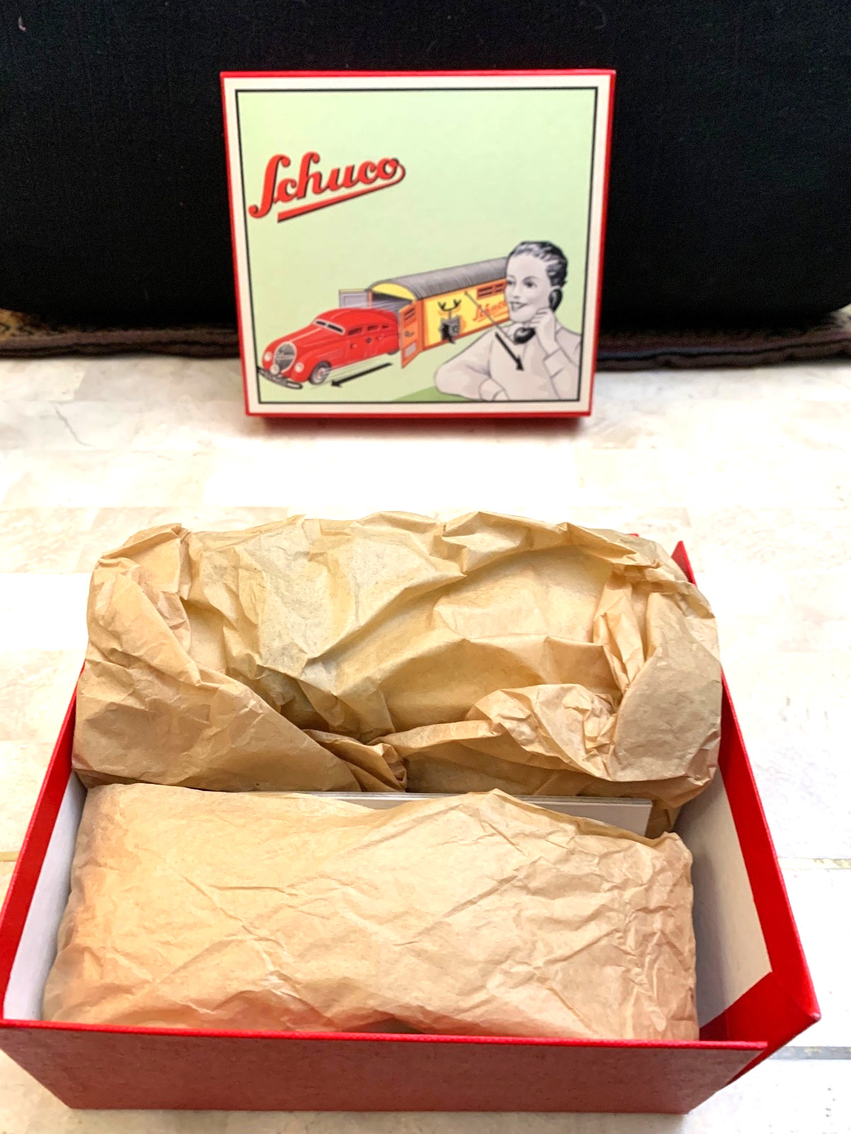 SCHUCO ,CAR ,GARAGE Steel NEVER PLAYED WITH,IN THE BOX.WORKS NEVER USED…