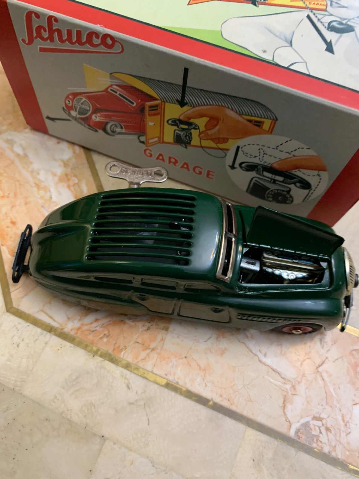 SCHUCO ,CAR ,GARAGE Steel NEVER PLAYED WITH,IN THE BOX.WORKS NEVER USED…