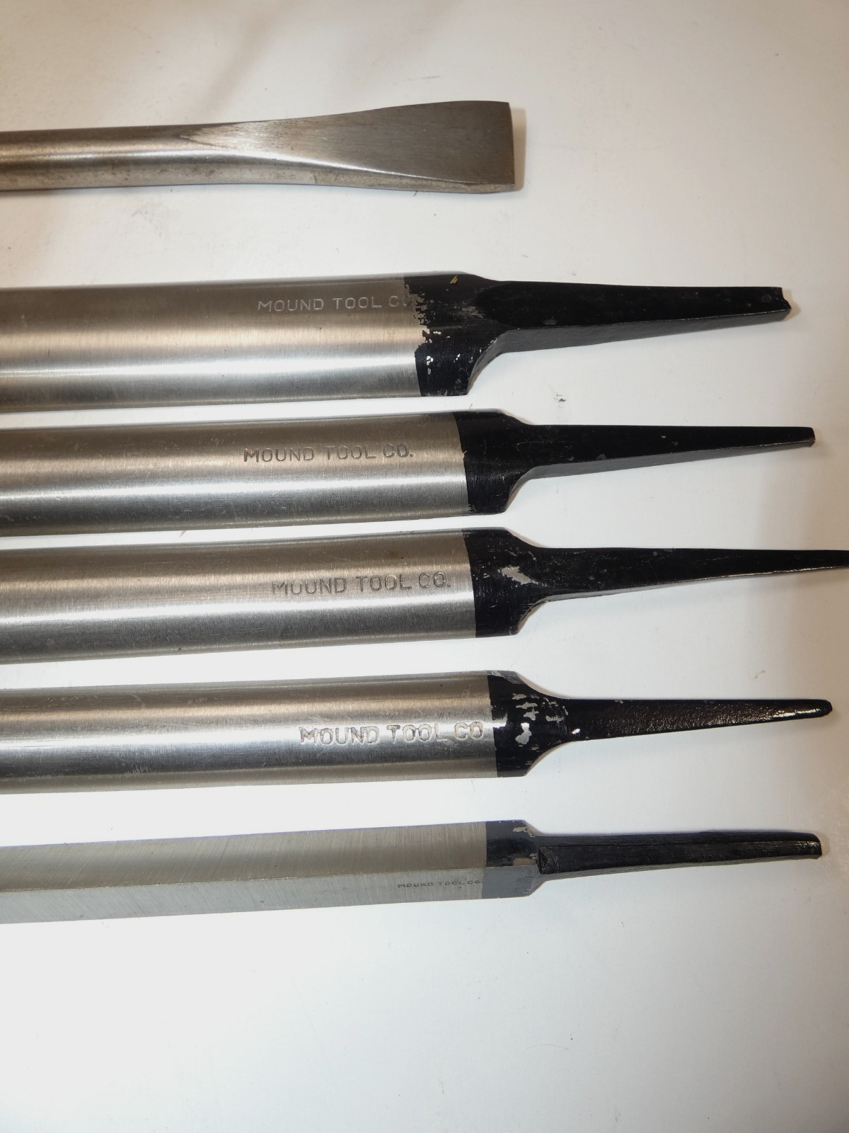 Set of six Mound Tool Steel scrapers; wood, sculpture