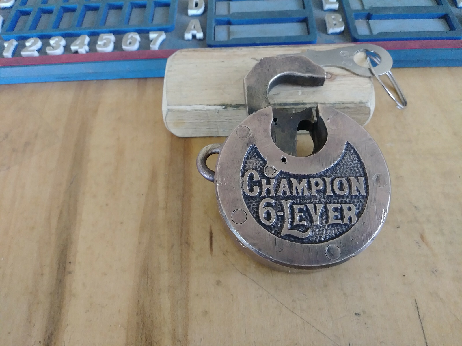 antique/vintage MILLER CHAMPION 6 lever push key pancake padlock w/key 523