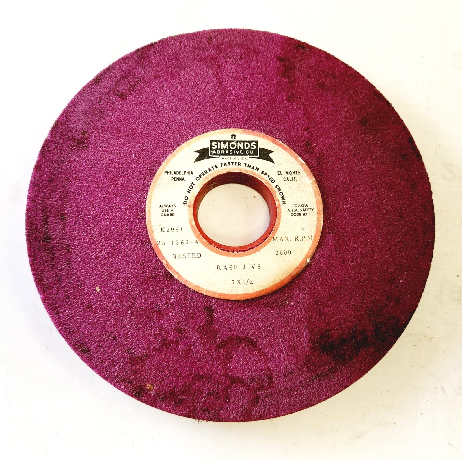 SIMONDS 6-5/8″X 1/2″ THICK X 1-1/4″A.H., 60GRIT RUBY GRINDING WHEEL (USED CON.)