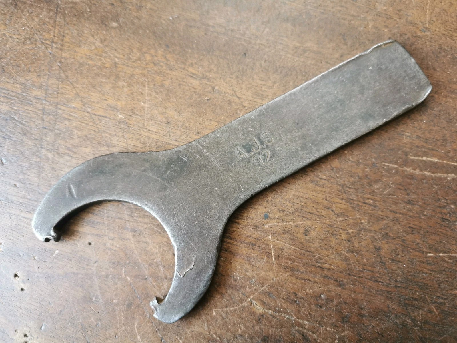 Vintage motorcycle spanner marked A. J. S. 92 for classic motorcycle toolkit.