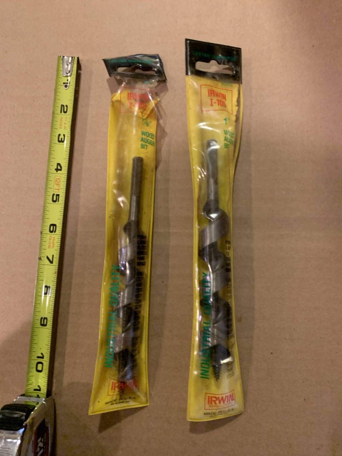One 7/8 and one 1 inch wood auger bits 7 1/2 long