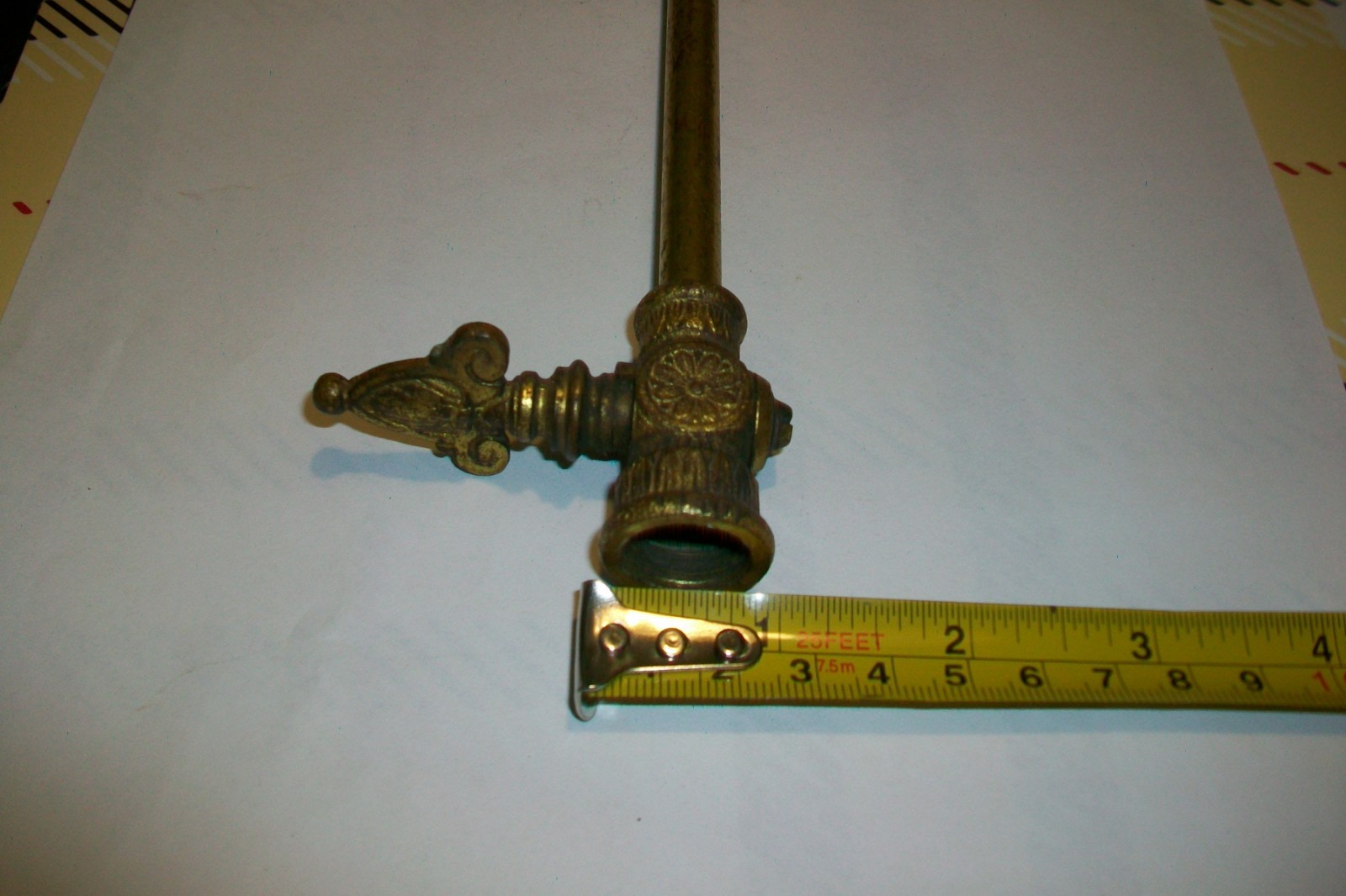 Antique vintage brass ornate gas shut off line valve.