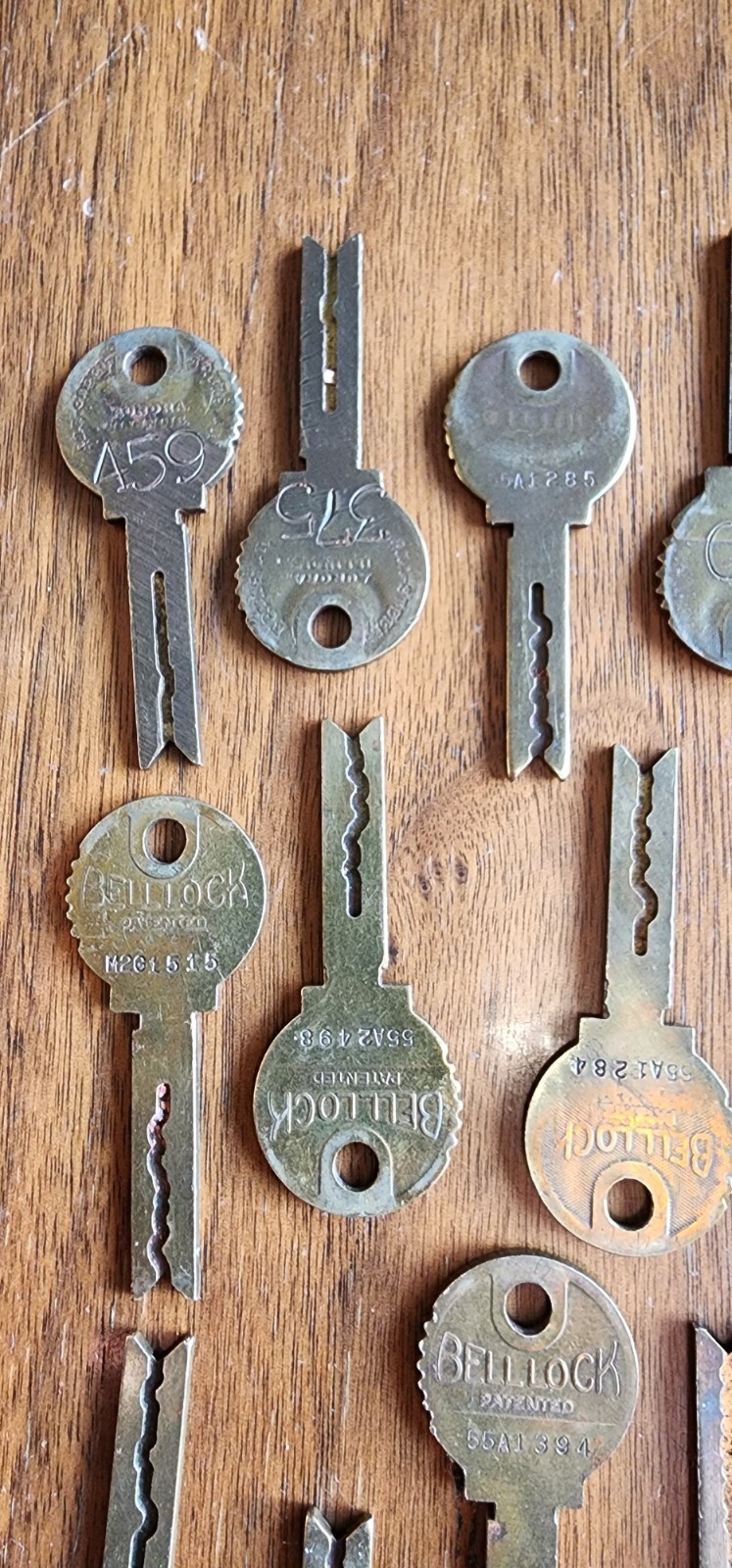 Twenty One Vintage BELL LOCK Keys Brass 2 1/4″ Long. Stamped Aurora Illinois