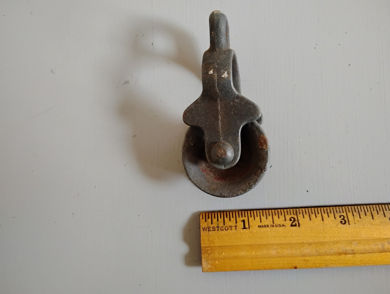 Vintage small cast iron pulley. Some surface rust, but works well.