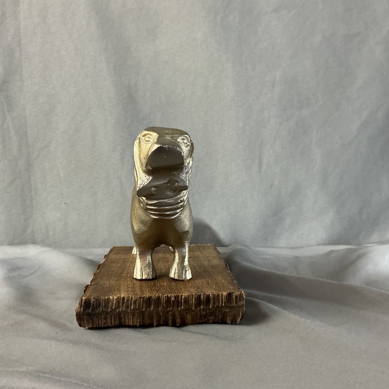 Golden Dachsung Wiener dog gold with wooden base made in India