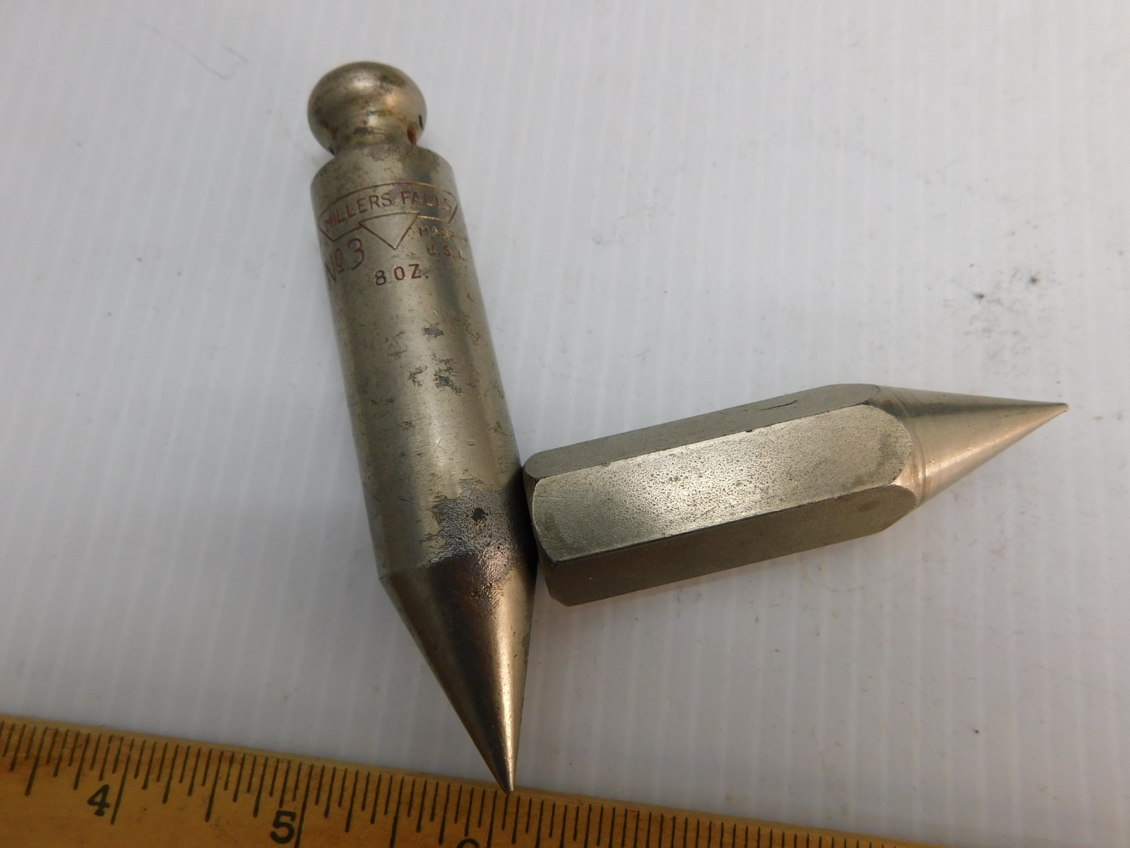 2 plumb Bobs , Miller Falls #3, 8 oz. 4″, plus an unmarked one