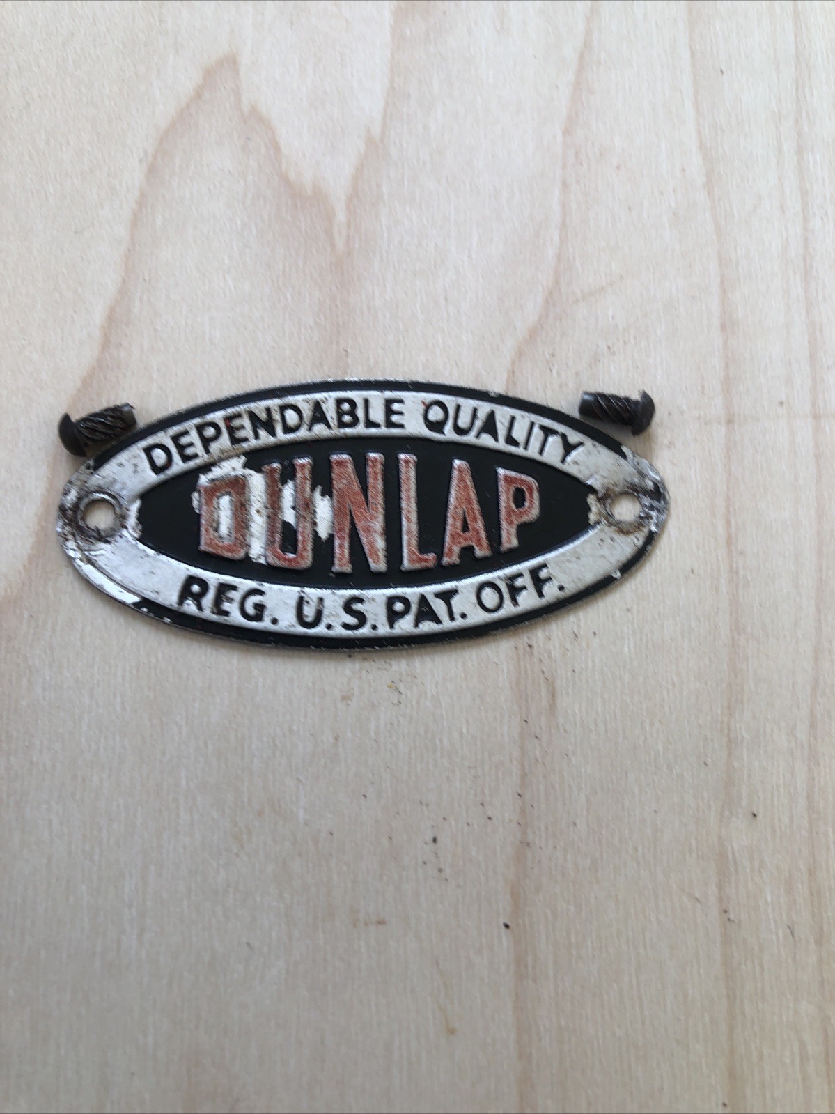 VINTAGE DUNLAP DEPENDABLE QUALITY REG. U.S. PAT. OFF. EMBLEM FROM A BENCH VISE
