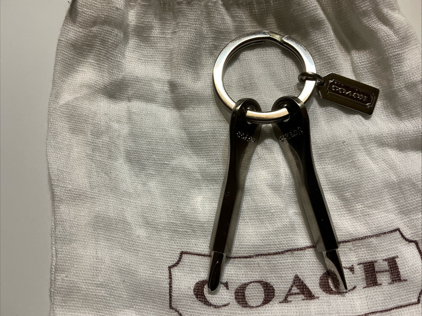 Coach Novelty Phillips Head And Flathead Screwdrivers Keychain. With dust bag.