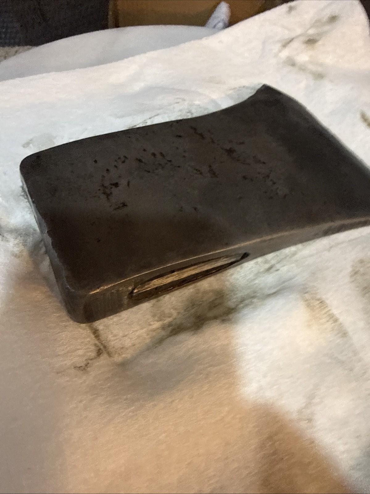 This vintage single-bit axe head By Mann Edge Tool Co.