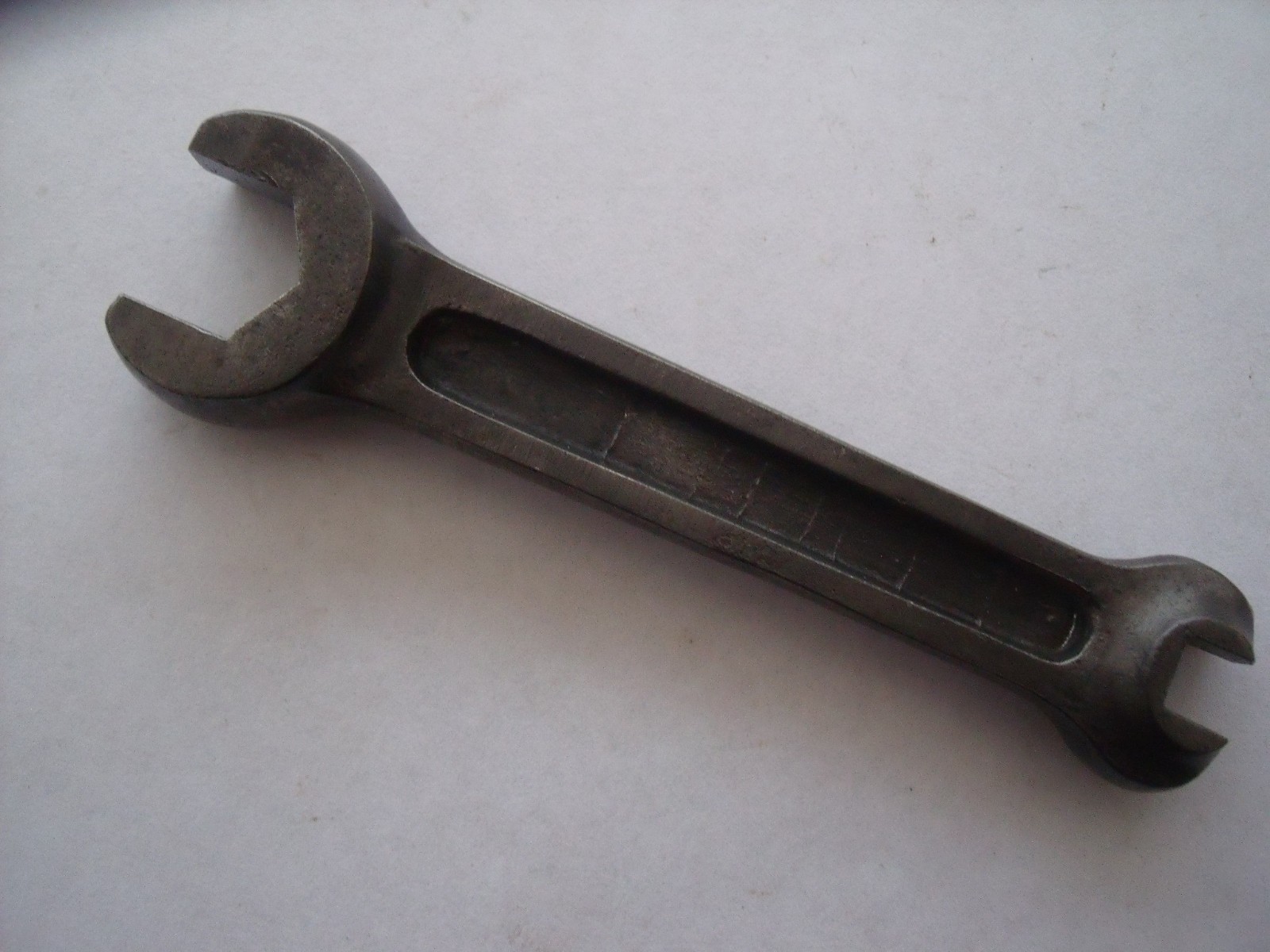 Coventry Climax 4 way multi spanner. 4″ long.