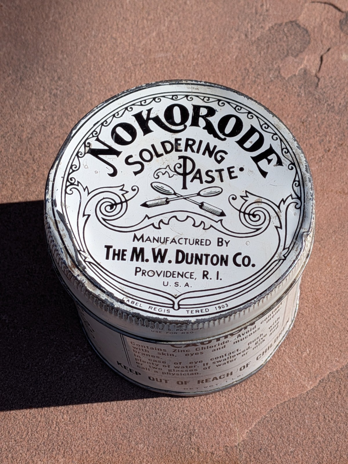 Nokorode Soldering Paste Tin 3” wide x 3 1/2″” tall 1926 Patent $8.50