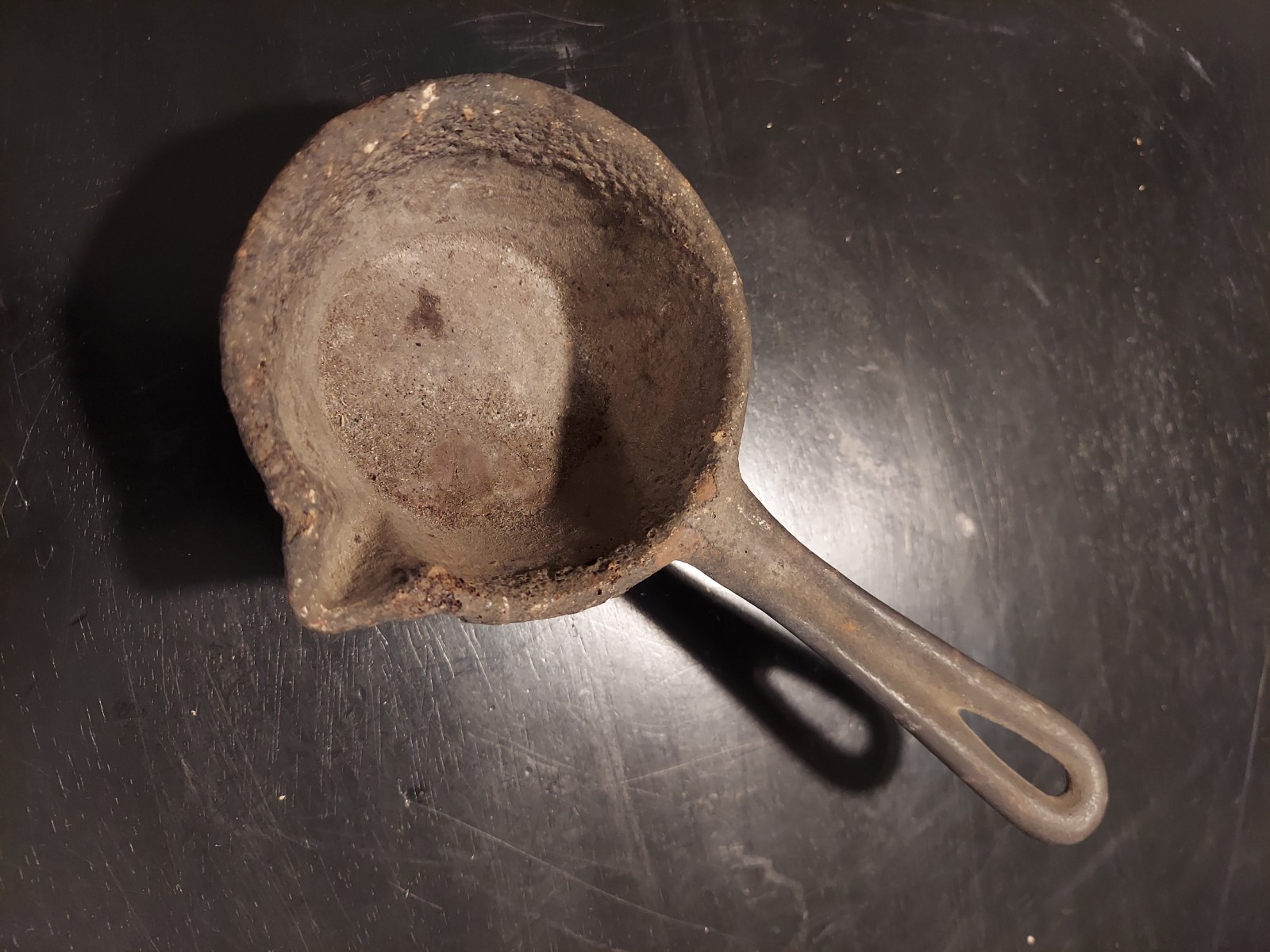 Antique Cast Iron Ladle used for smelting or melting materials like lead