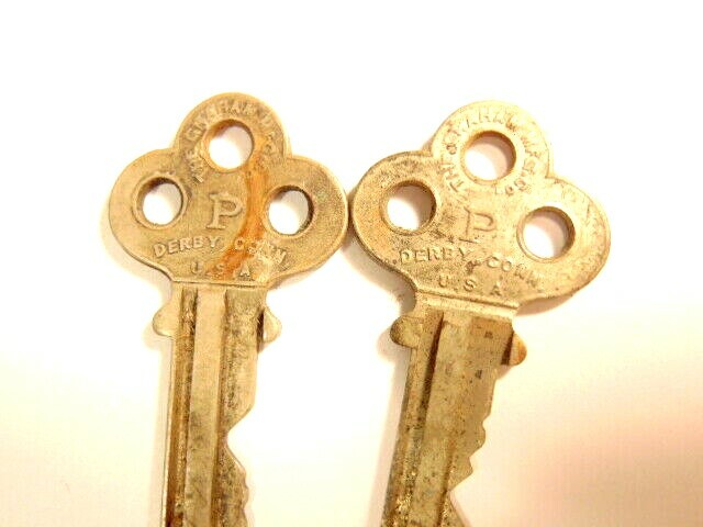 2 old keys with a large “P” on each side: The Graham Mfg Co., Derry Conn.