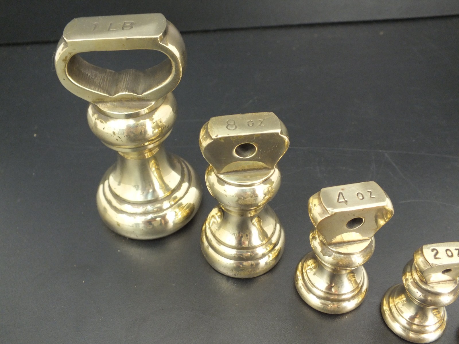 SET OF 7 VINTAGE BRASS BELL WEIGHTS 1LB – 1/4 OZ KITCHEN SCALES